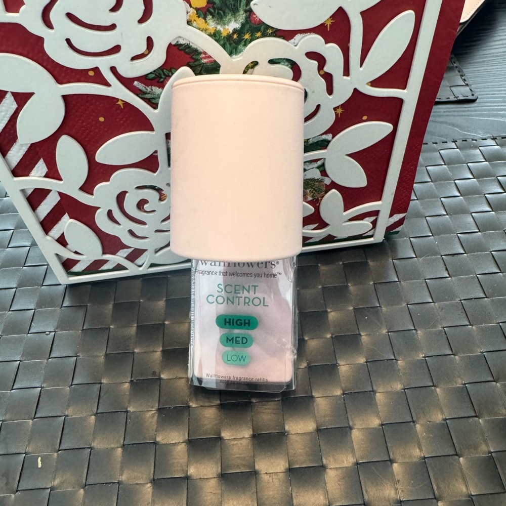 Light pink scent control wallflower plug from bath &body works